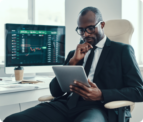 man in office looking at tablet