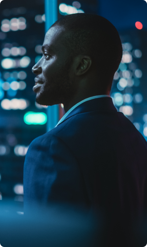 black investor staring out of window