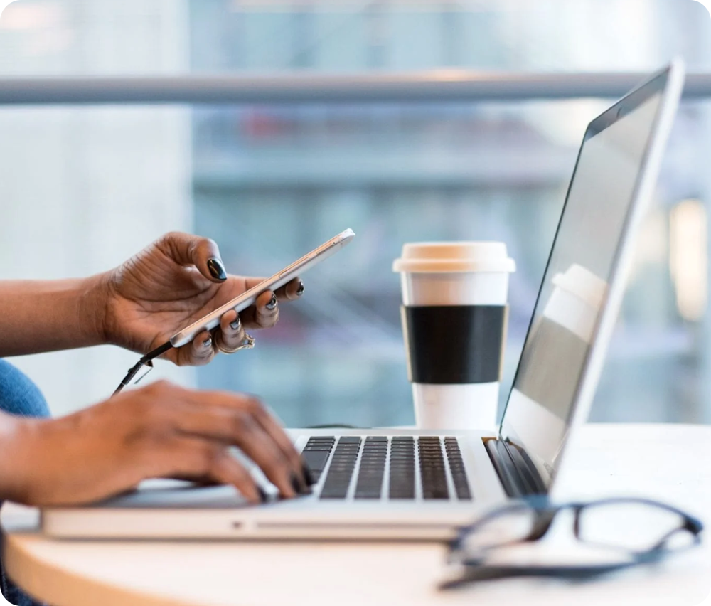 cellphone and laptop in office