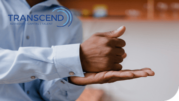 mans hand with fist and thumbs up rested on open palm