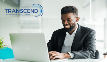 Man smiling at laptop