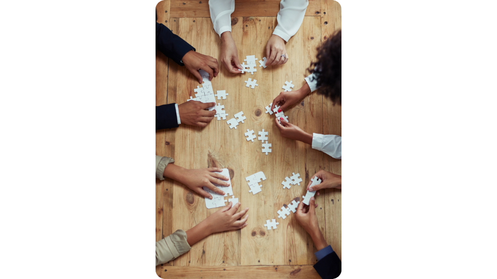 Team building a puzzle, illustrating Disability Learnerships approach.