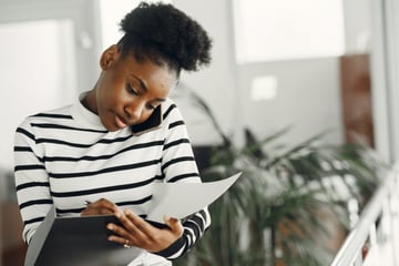 Black woman professional taking notes